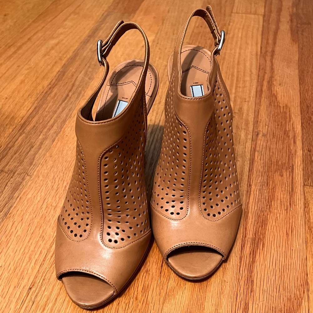Prada Women Perforated Mary Jane Strap Heel.